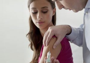 A young patient gets vaccinated