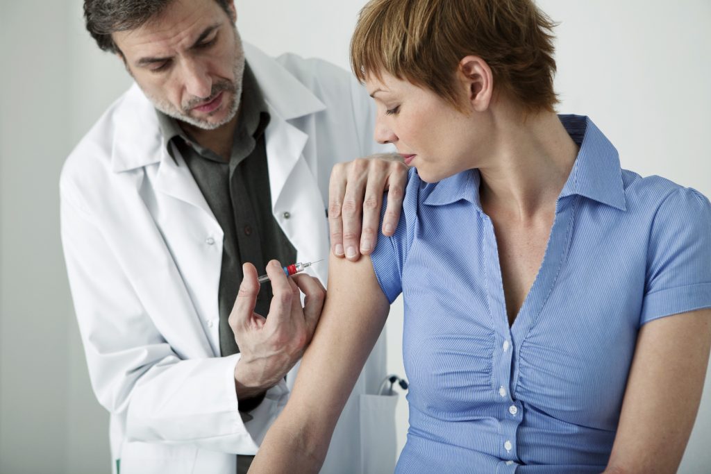 Adult woman receiving vaccine