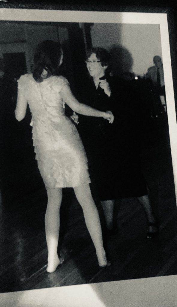 A black and white photo of a couple dancing